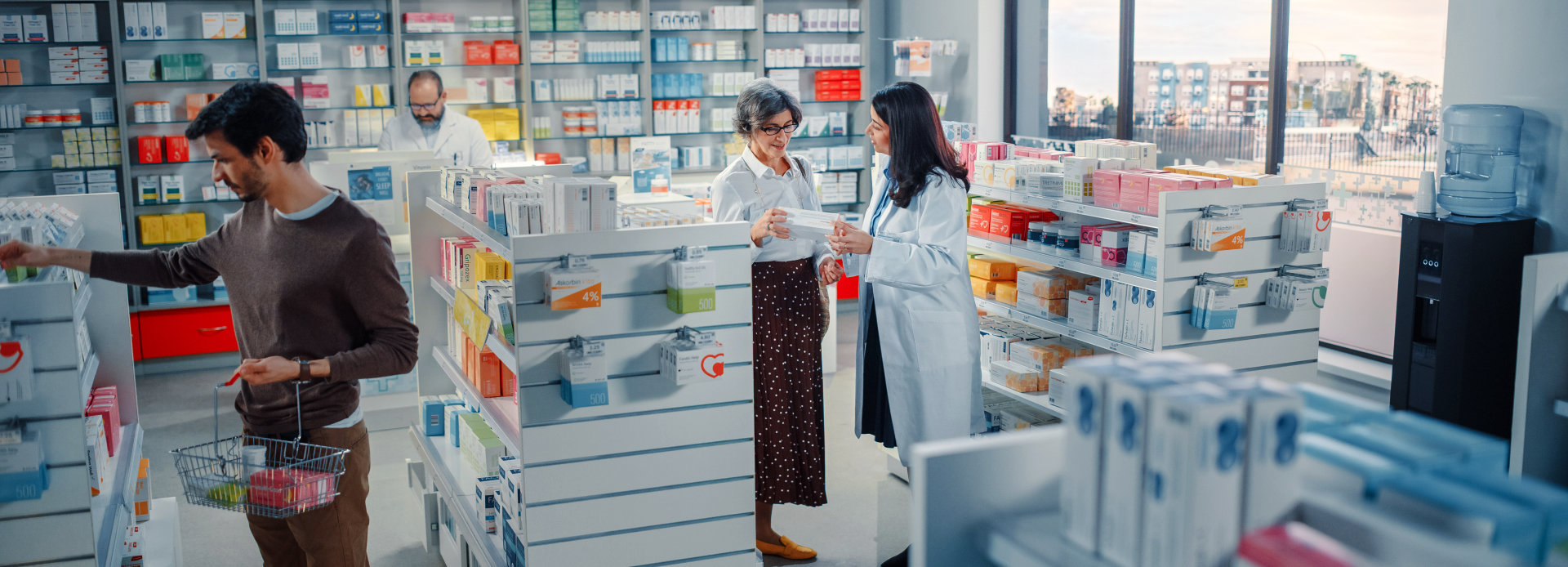 senior woman talking to pharmacist