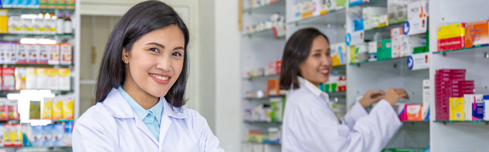 two pharmacist smiling