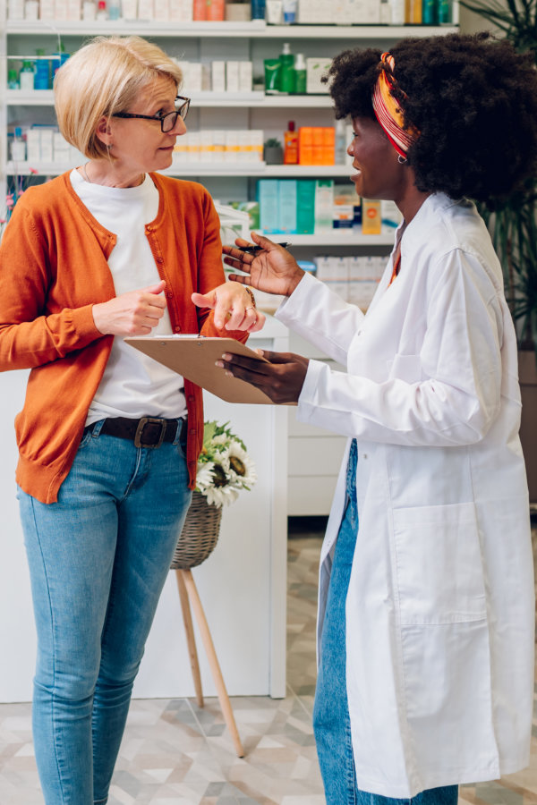 pharmacist talking to customer