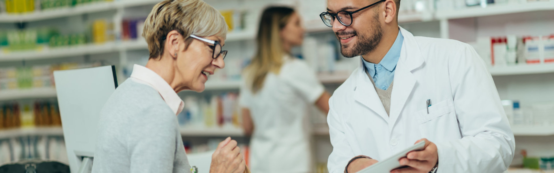 woman talking to the pharmacist